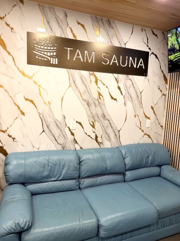 Leather sofa under the Tam Sauna sign