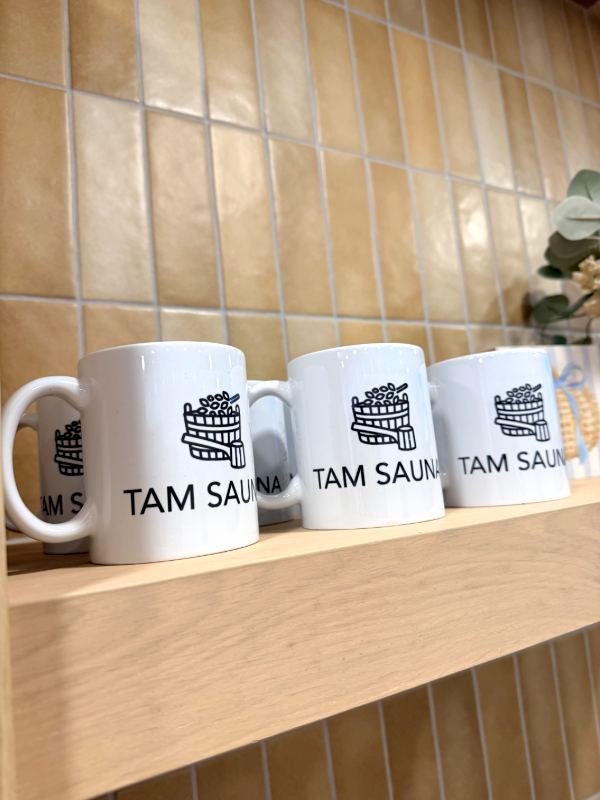 Tam Sauna mugs on a shelf