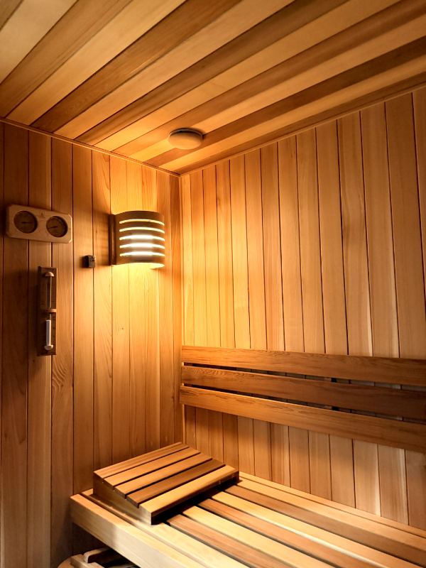 Sauna corner with a wall lamp