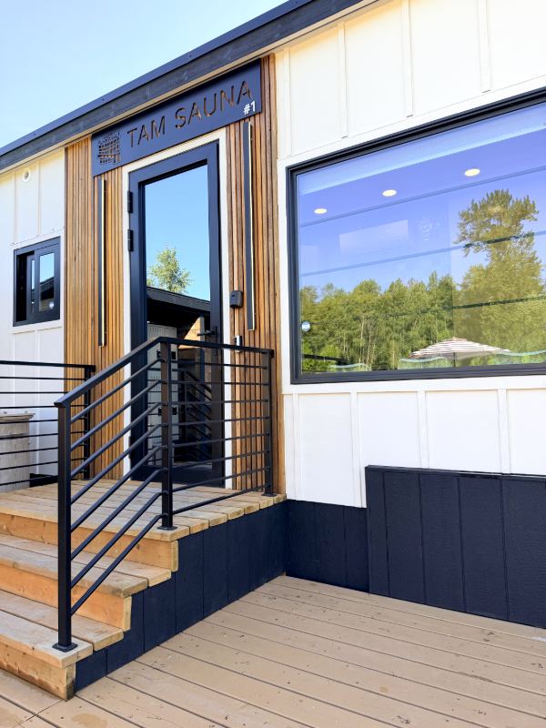 Modern sauna house with stairs and big windows