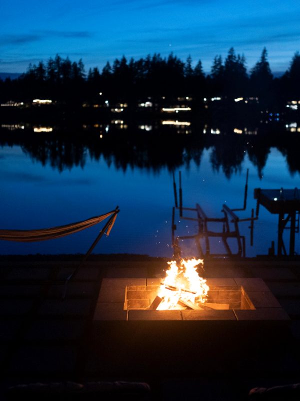 Fire pit and dock on Lake Tapps at dusk