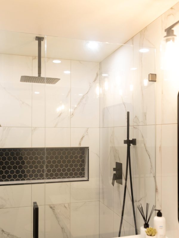 Walk-in shower with marble tiles