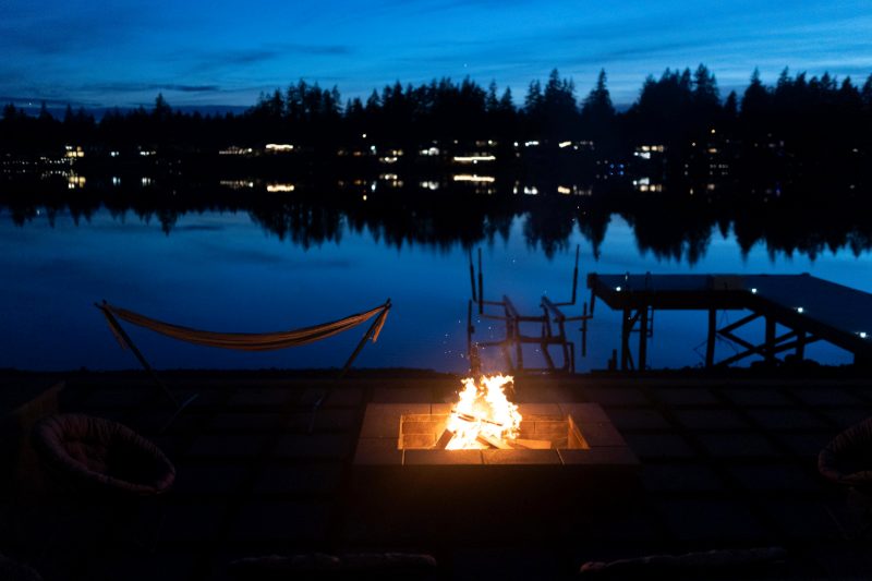 Fire pit and dock on Lake Tapps at dusk