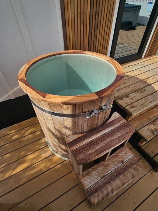 Cedar cold plunge barrel on a wooden deck