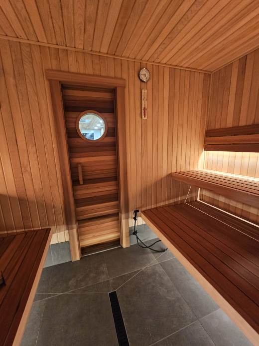 Cedar sauna room with benches